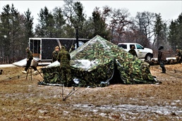 Marines practice tent building during Cold-Weather Operations Course training at Fort McCoy