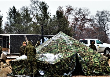 Marines practice tent building during Cold-Weather Operations Course training at Fort McCoy