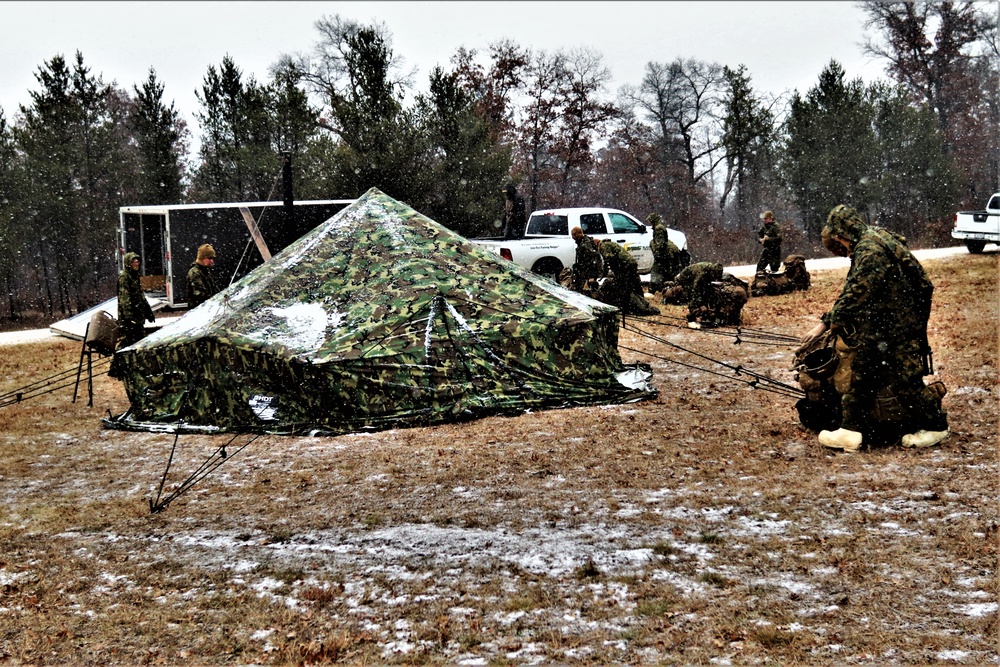 Marines practice tent building during Cold-Weather Operations Course training at Fort McCoy