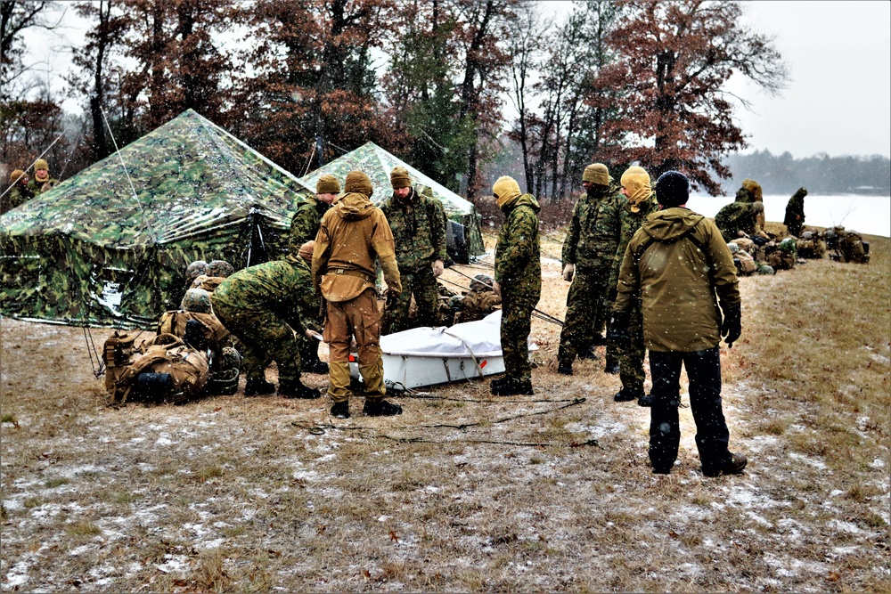 Marines practice tent building during Cold-Weather Operations Course training at Fort McCoy