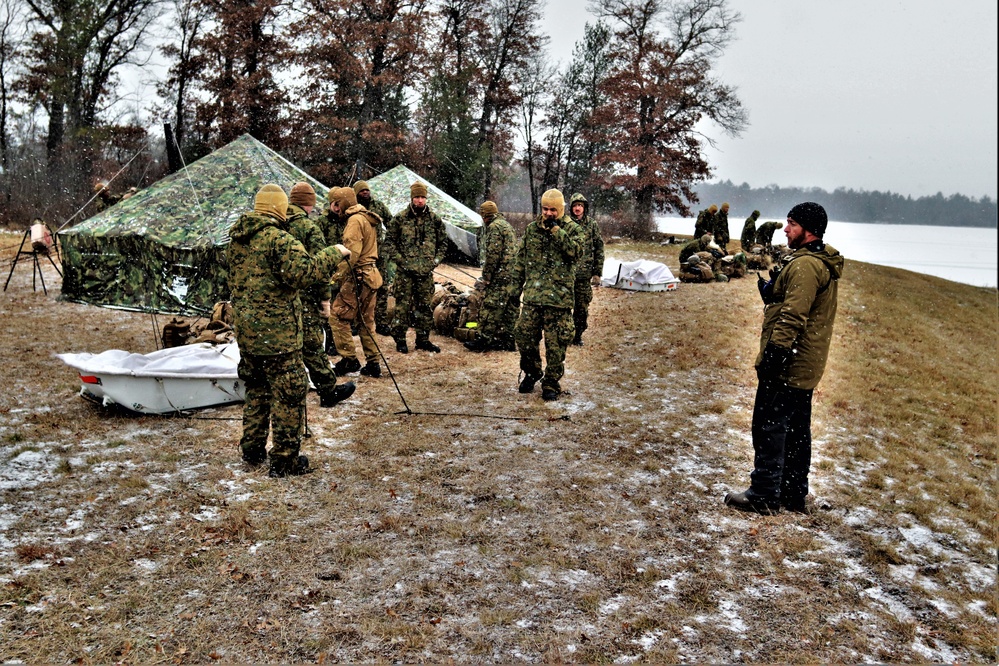 Marines practice tent building during Cold-Weather Operations Course training at Fort McCoy