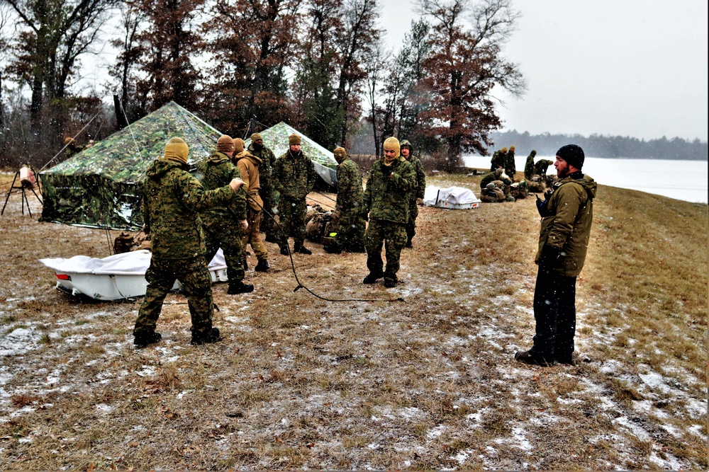 Marines practice tent building during Cold-Weather Operations Course training at Fort McCoy