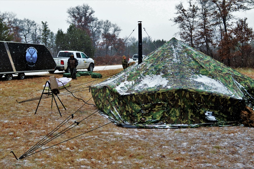 Marines practice tent building during Cold-Weather Operations Course training at Fort McCoy