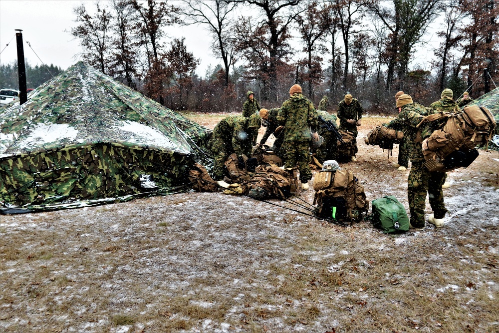 Marines practice tent building during Cold-Weather Operations Course training at Fort McCoy