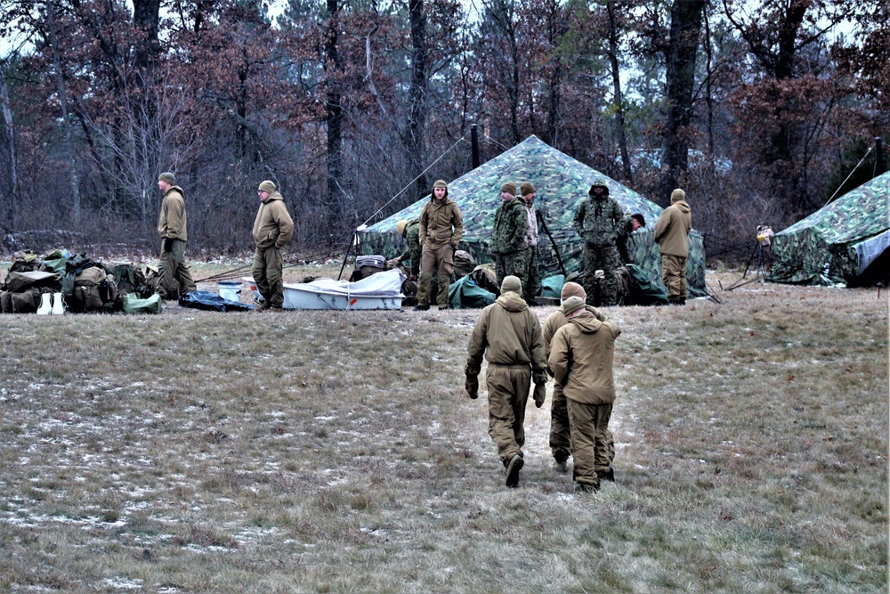 Marines practice tent building during Cold-Weather Operations Course training at Fort McCoy