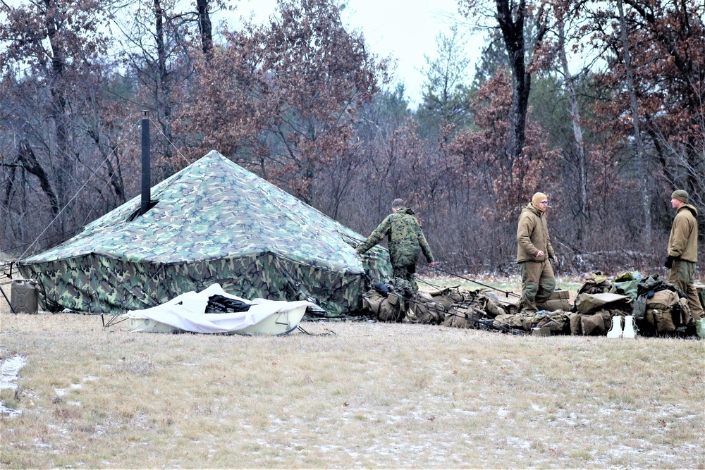 Marines practice tent building during Cold-Weather Operations Course training at Fort McCoy