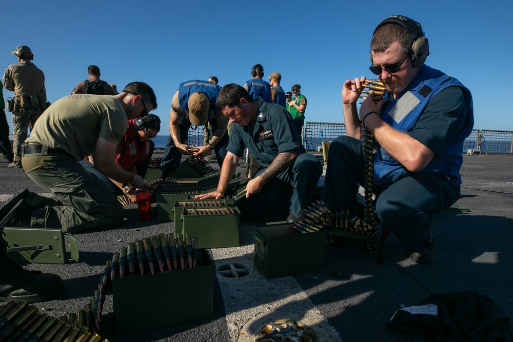 USS Sioux City Sailors Unpack Ammunition During Live-Fire Exercise