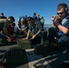 USS Sioux City Sailors Unpack Ammunition During Live-Fire Exercise