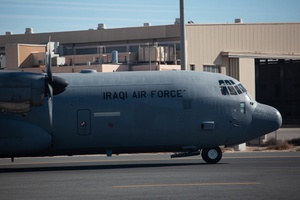 US and Iraqi airmen turning wrenches together