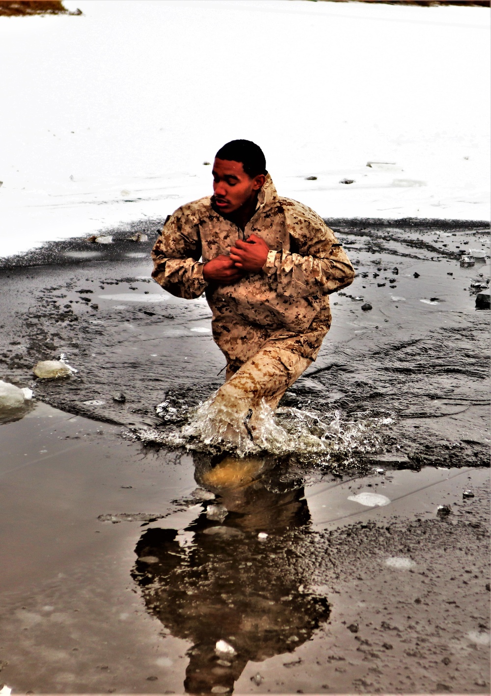 Marines jump in for cold-water immersion training during CWOC ops at Fort McCoy