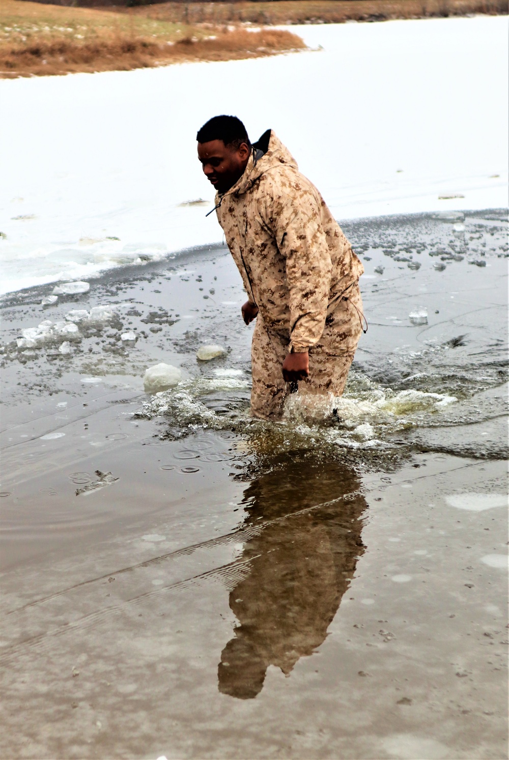 Marines jump in for cold-water immersion training during CWOC ops at Fort McCoy