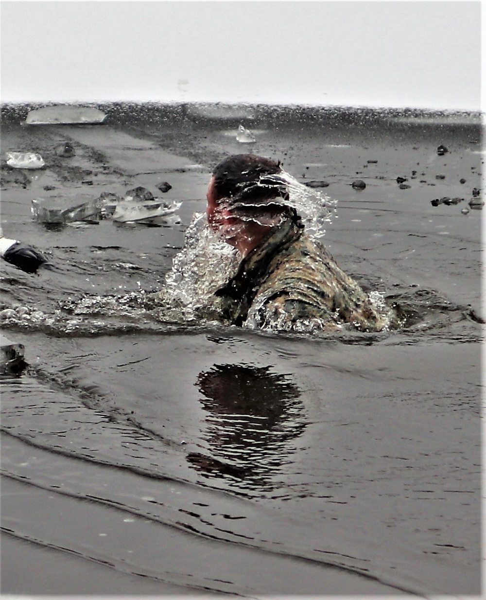 Marines jump in for cold-water immersion training during CWOC ops at Fort McCoy