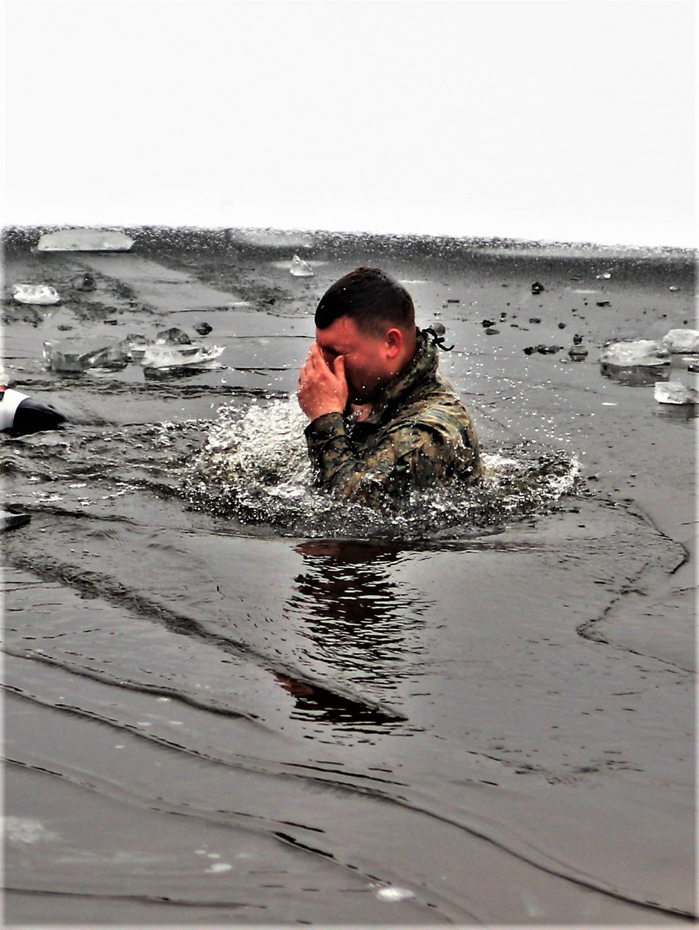 Marines jump in for cold-water immersion training during CWOC ops at Fort McCoy