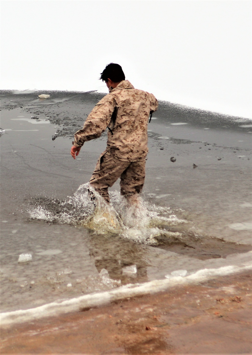 Marines jump in for cold-water immersion training during CWOC ops at Fort McCoy