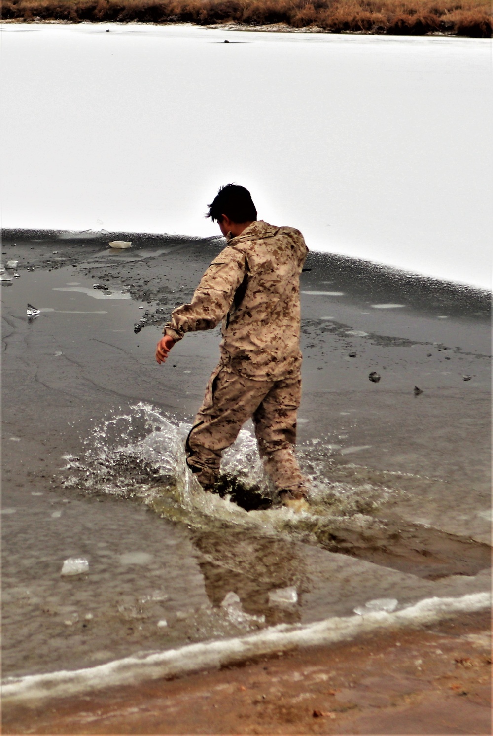 Marines jump in for cold-water immersion training during CWOC ops at Fort McCoy