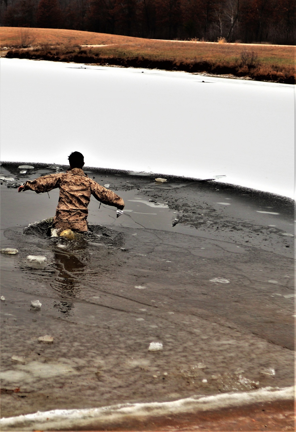 Marines jump in for cold-water immersion training during CWOC ops at Fort McCoy