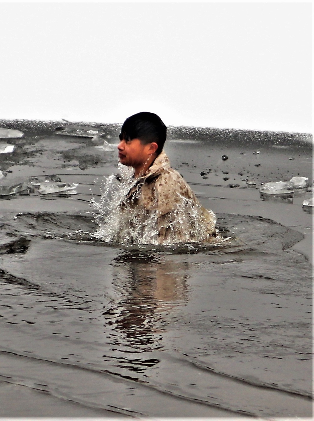 Marines jump in for cold-water immersion training during CWOC ops at Fort McCoy