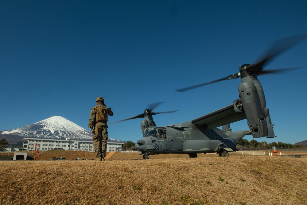 U.S. Marines fuel a U.S. Air Force CV-22 Osprey