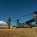 U.S. Marines fuel a U.S. Air Force CV-22 Osprey