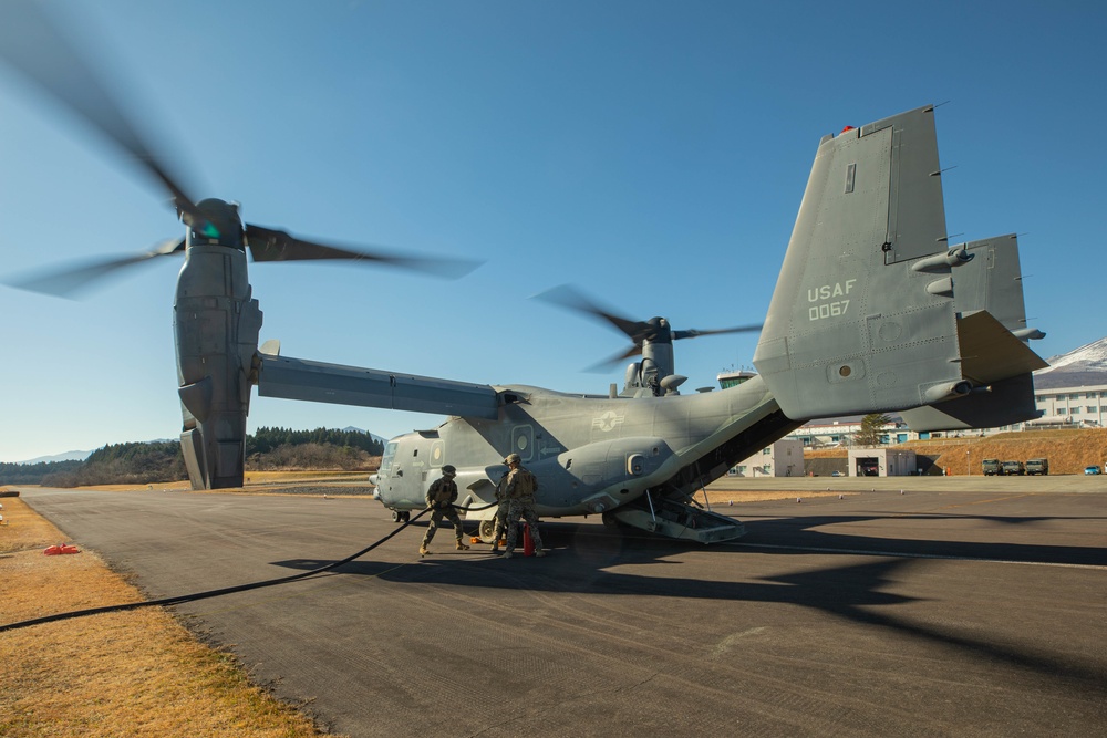 U.S. Marines fuel a U.S. Air Force CV-22 Osprey