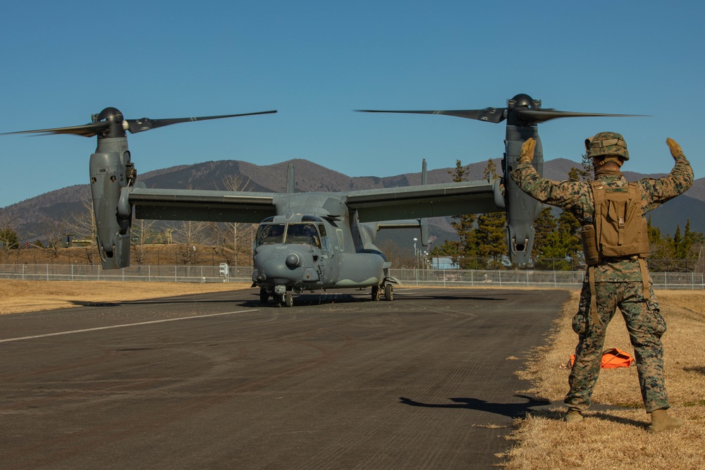 U.S. Marines fuel a U.S. Air Force CV-22 Osprey