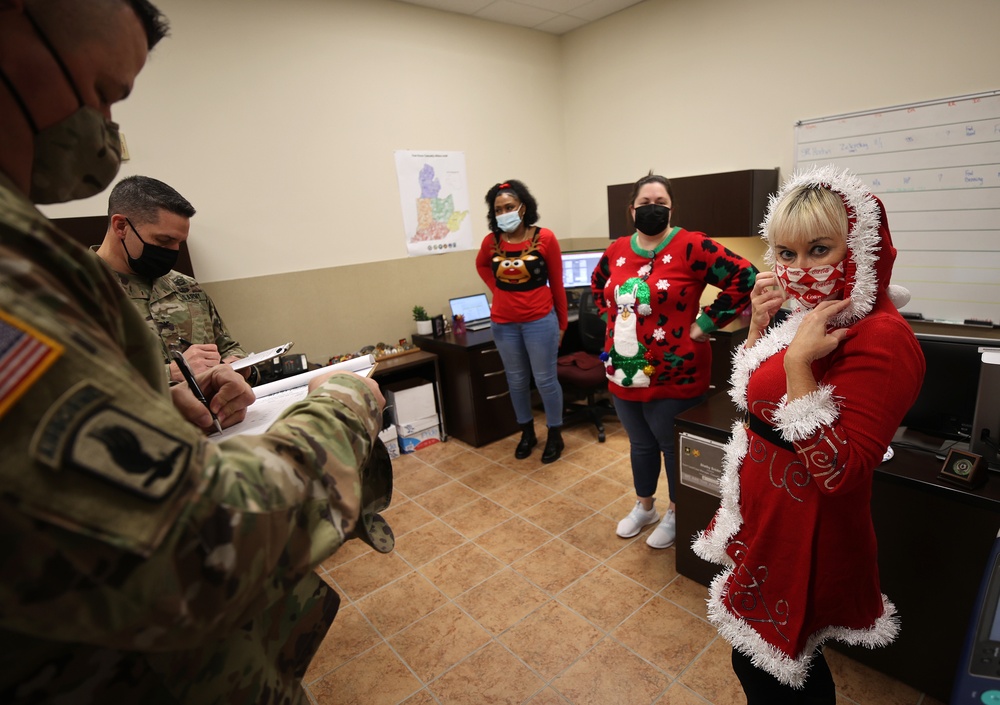 Fort Knox Garrison leaders judge Military Personnel Division holiday office, personnel decorating contest