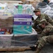 Soldiers load palatized supplies for tornado relief efforts