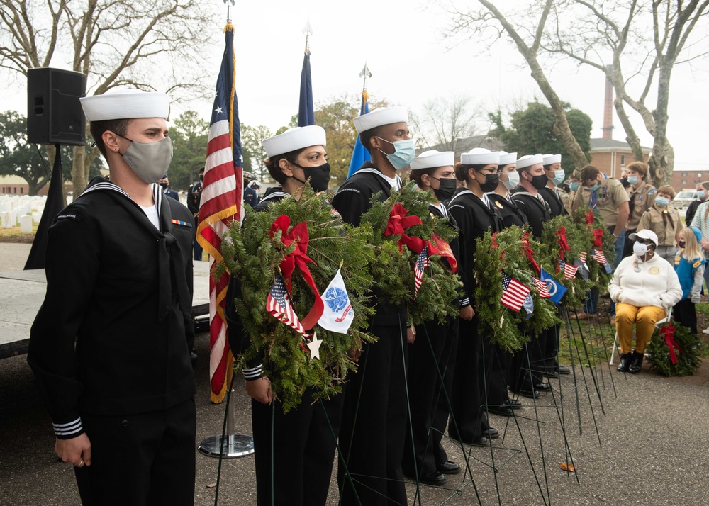 USS John C. Stennis Sailors lay wreaths during a ceremony