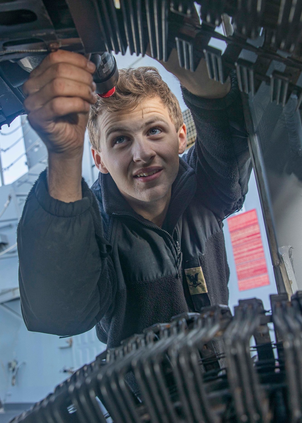 Sailor Loads Machine Gun