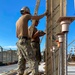 US Navy Seabees with NMCB-5 build formwork for the Ground/Air Task-Oriented Radar project onboard Camp Hansen