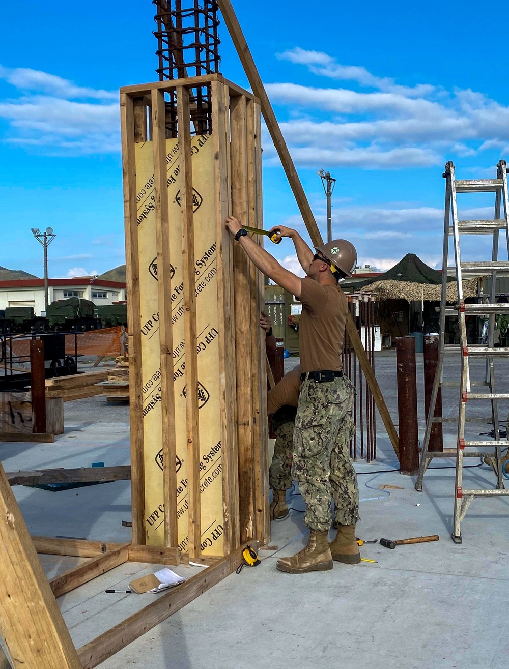 US Navy Seabees with NMCB-5 build formwork for the Ground/Air Task-Oriented Radar project onboard Camp Hansen