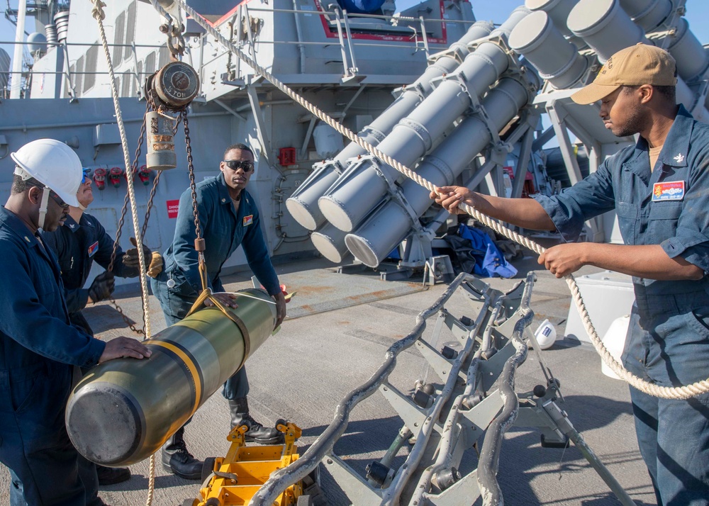 Sailors Load Torpedo