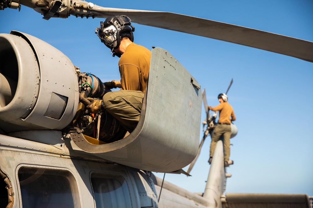 HSC 28 Sailors Conduct Pre-Flight Checks of MH-60S Sea Hawk Helicopter