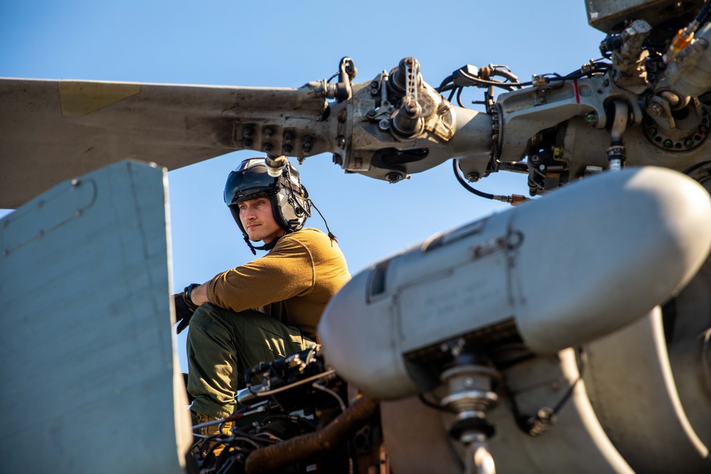 HSC 28 Sailor Conducts Pre-Flight Checks of MH-60S Sea Hawk Helicopter