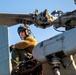 HSC 28 Sailor Conducts Pre-Flight Checks of MH-60S Sea Hawk Helicopter