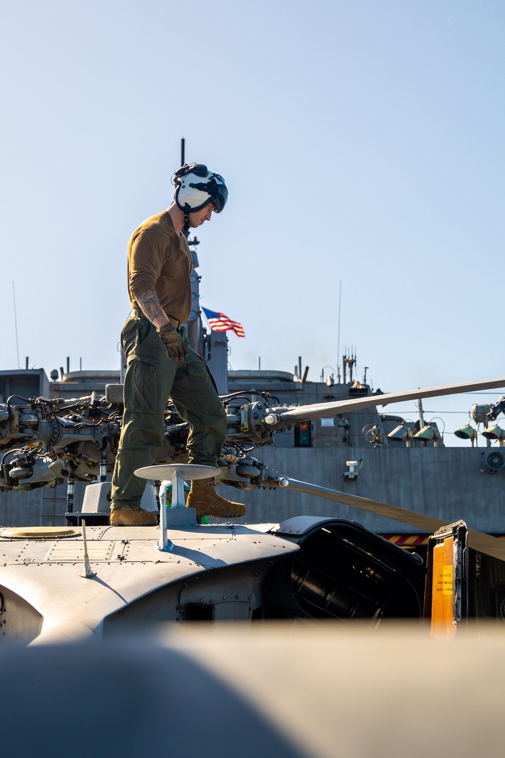 HSC 28 Sailor Conducts Pre-Flight Checks of MH-60S Sea Hawk Helicopter