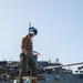 HSC 28 Sailor Conducts Pre-Flight Checks of MH-60S Sea Hawk Helicopter