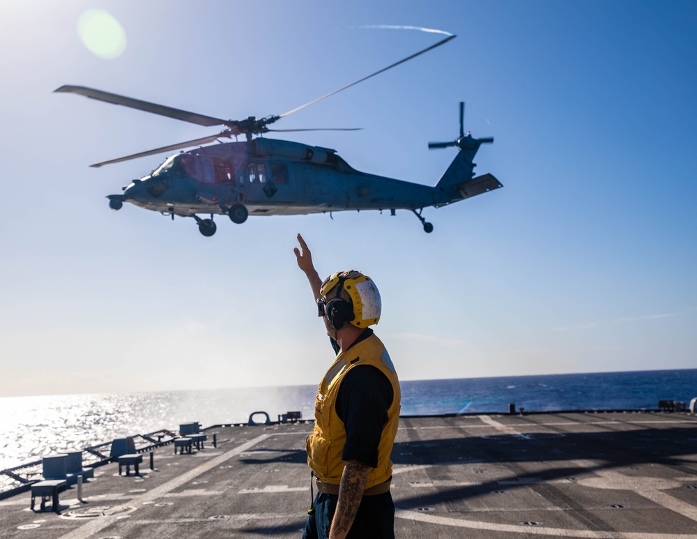 USS Billings Sailor Launches a MH-60S Sea Hawk Helicopter