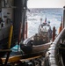 Coast Guardsmen and Sailors Assigned to USS Billings Launch a RHIB Boat