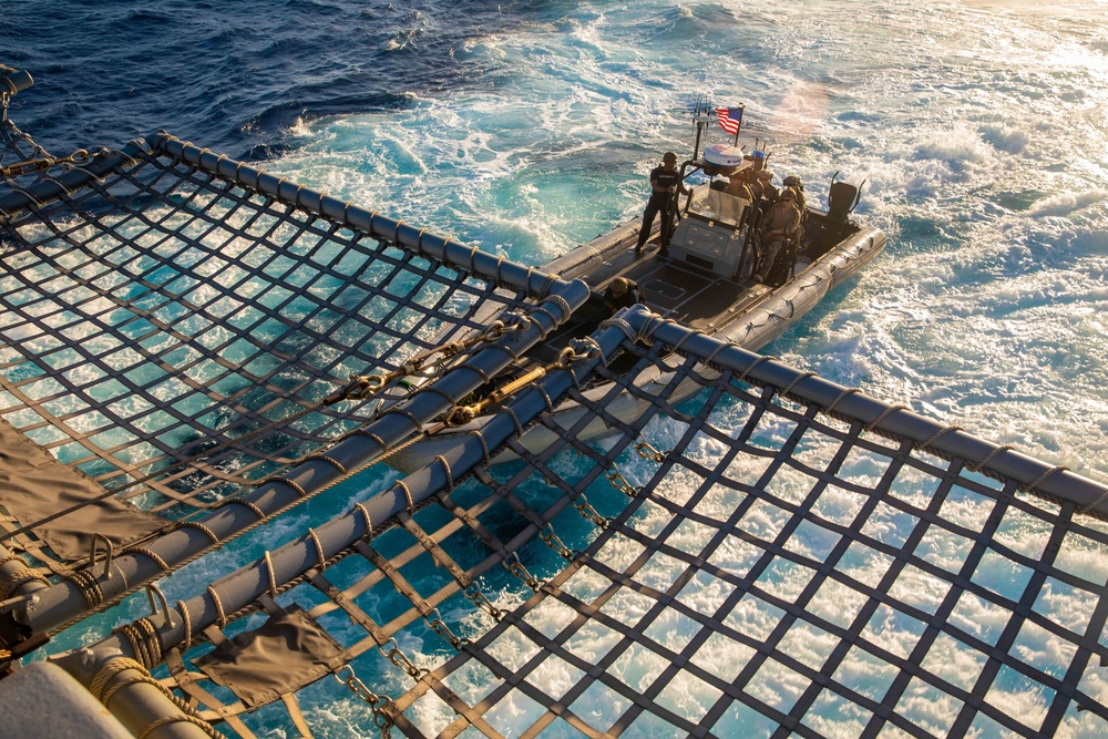 Coast Guardsmen and Sailors Assigned to USS Billings Recover RHIB