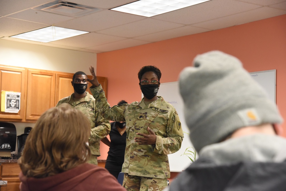 Michigan National Guard members discuss career goals with local high school students during Military Career Day