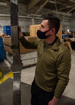 Crew chiefs rebuild F-22 after fiery crash