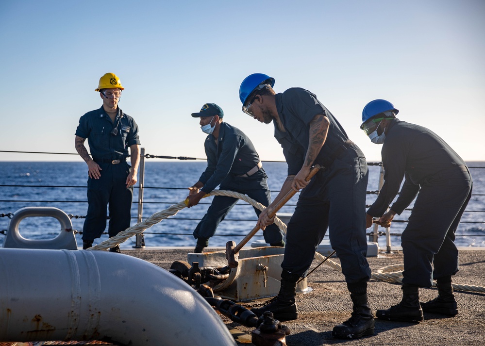 USS Milwaukee Sailors Remove the Pelican Hook on the Anchor Chain