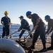 USS Milwaukee Sailors Remove the Pelican Hook on the Anchor Chain