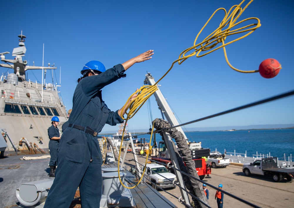 USS Milwaukee Sailor Throws Line to Workers on the Pier