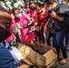 U.S. Air Force volunteer gives shoes to children in Honduras