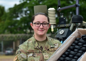 U.S. Air Force volunteer gives shoes to children in Honduras
