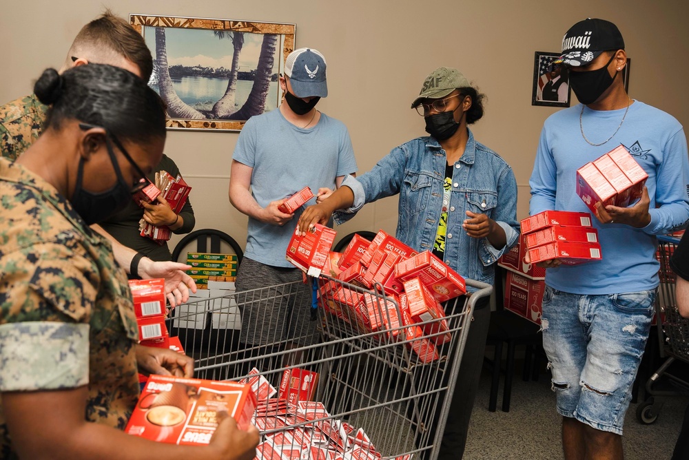 Holiday Food Basket Packing at the Hickam Commissary