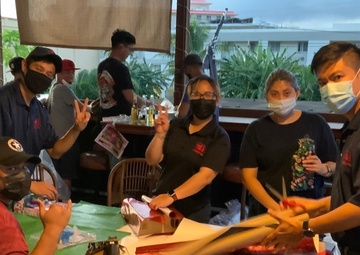 Military Sealift Command Contracted Mariners Share Holiday Cheer in Saipan