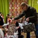 Supporting Santa: Novo Selo Training Area Personnel gift local schools